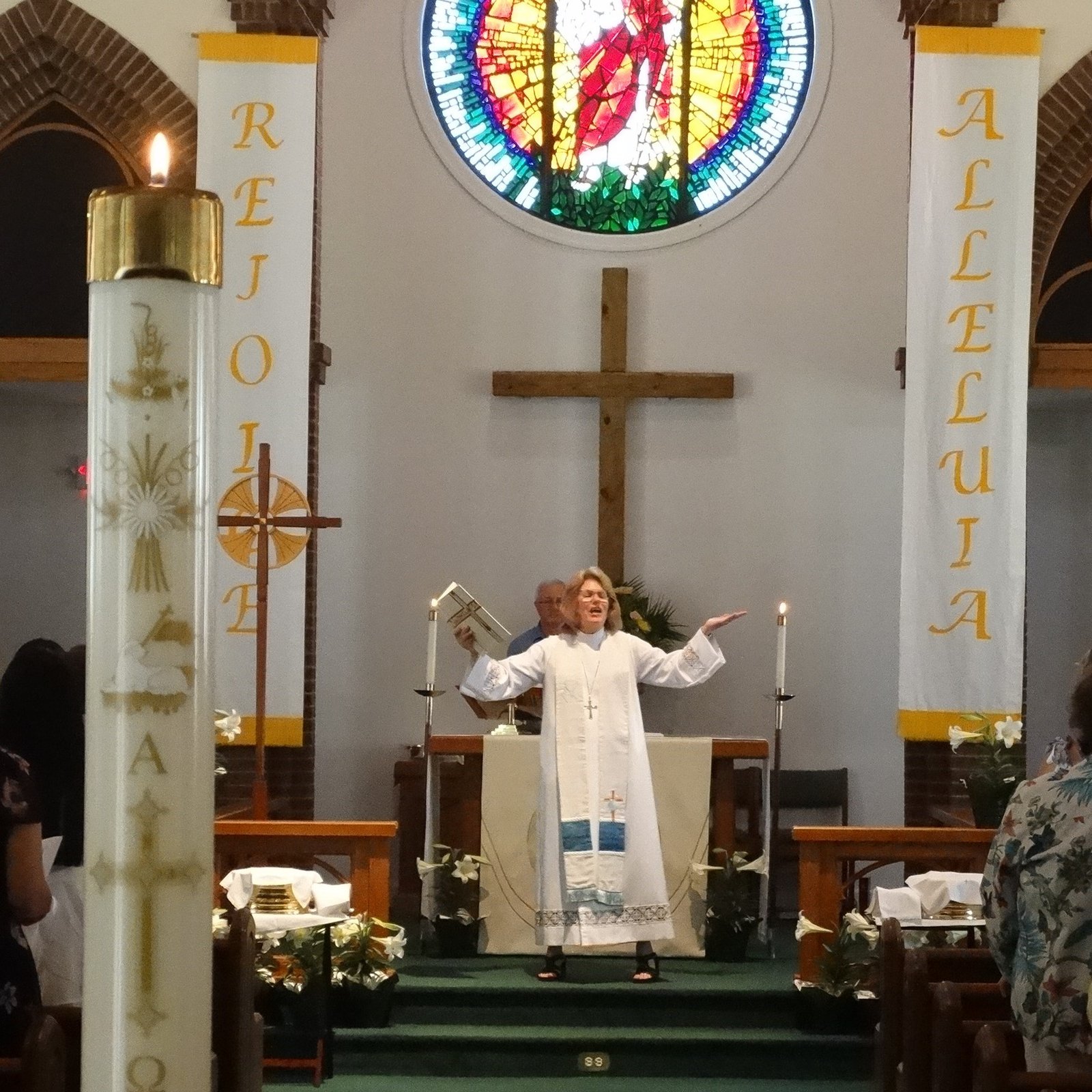 Pastor K at altar during Easter worship